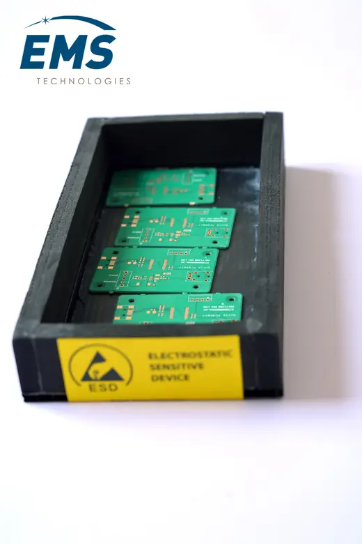EVA ESD bin holding circuit boards, electrostatic-sensitive-device labelled, EMS Technologies