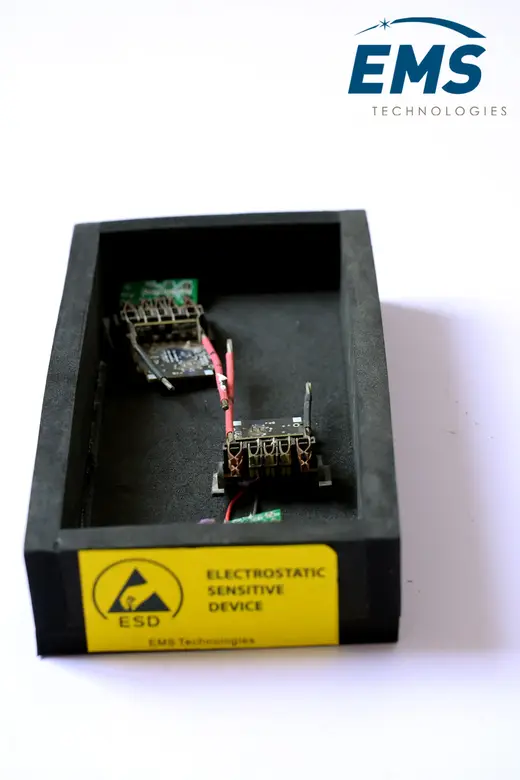 EVA ESD bin holding circuit boards, electrostatic-sensitive-device labelled, EMS Technologies