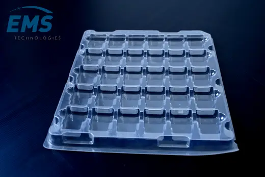 Clear anti-static PET tray with deep square pockets for ESD-safe component storage, EMS Technologies