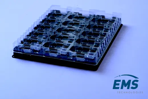 Clear anti-static PET pocket tray on a black conductive base tray, EMS Technologies