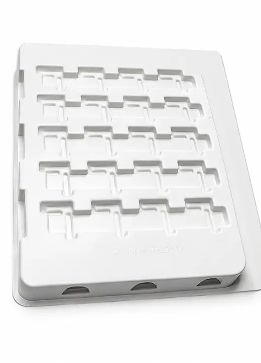White thermoformed ESD tray with tooled connector pockets, part number embossed in the rim, EMS Technologies